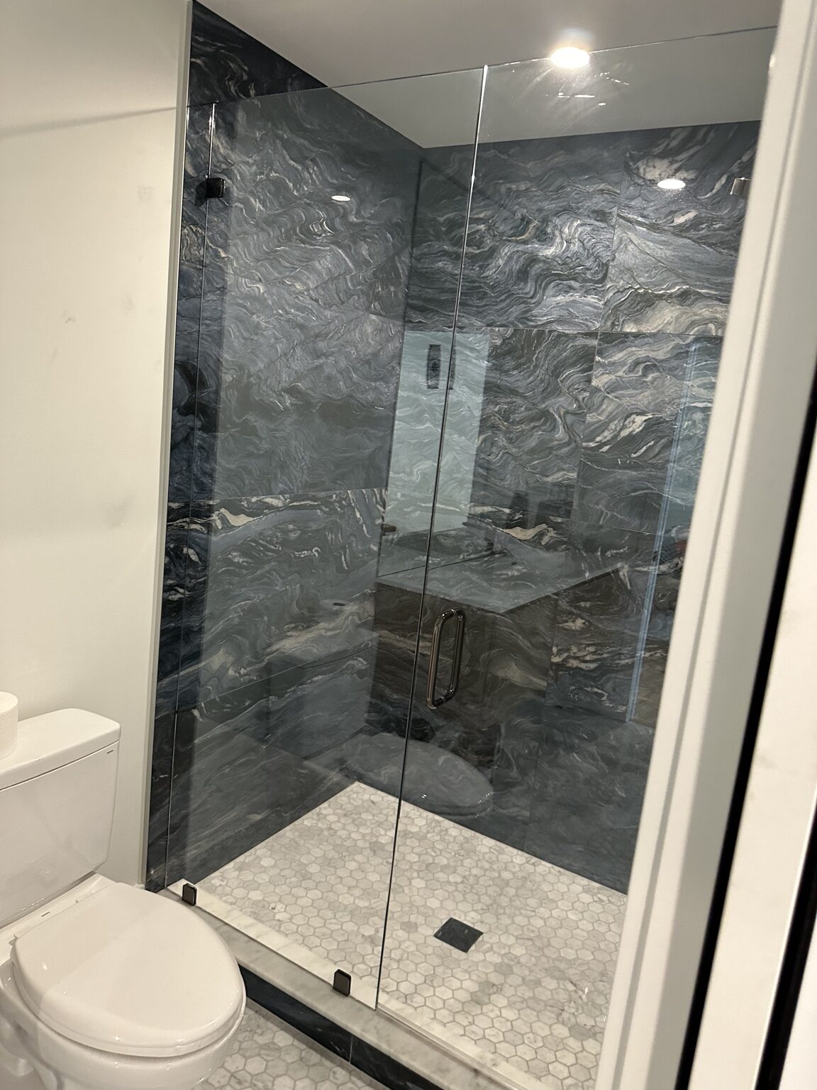 Frameless shower - marble tile